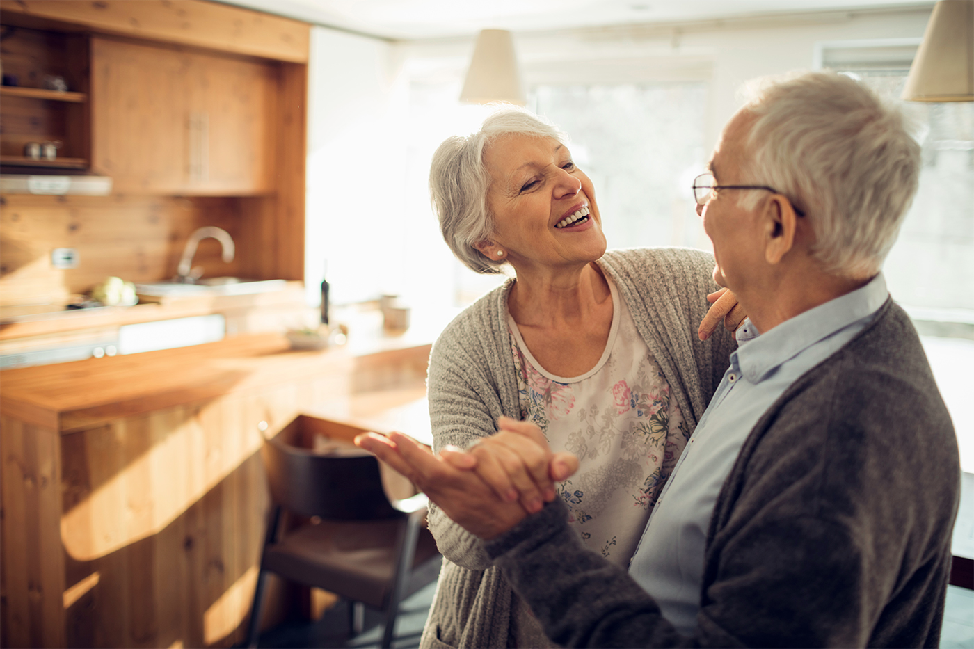 Couple laughing in their home